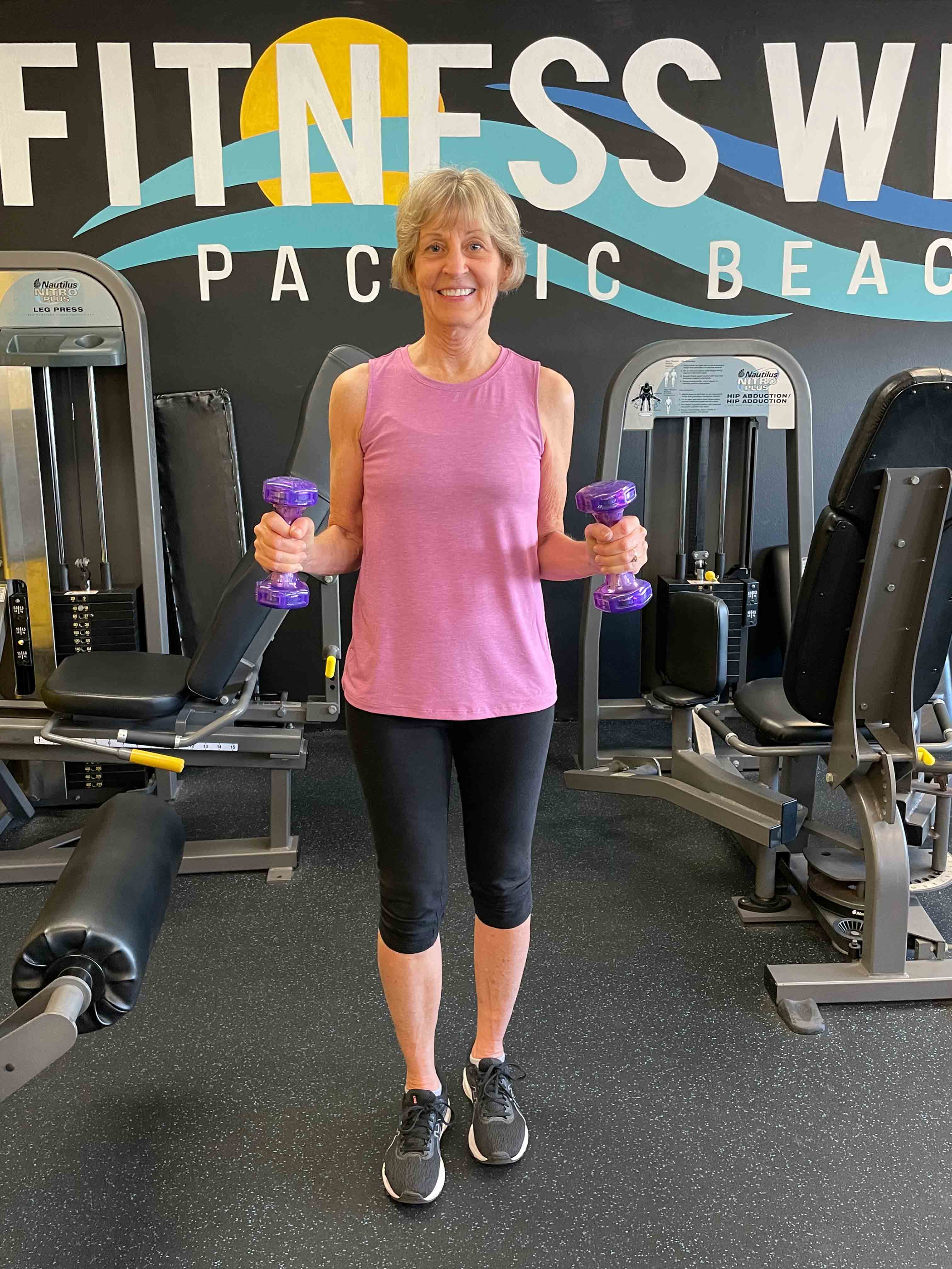 Best Health member Connie holding weights